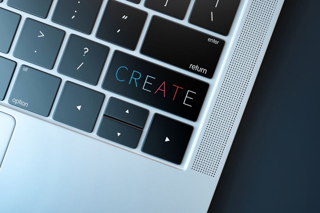 Ein Laptop mit einer Create-Taste zur Texterzeugung.